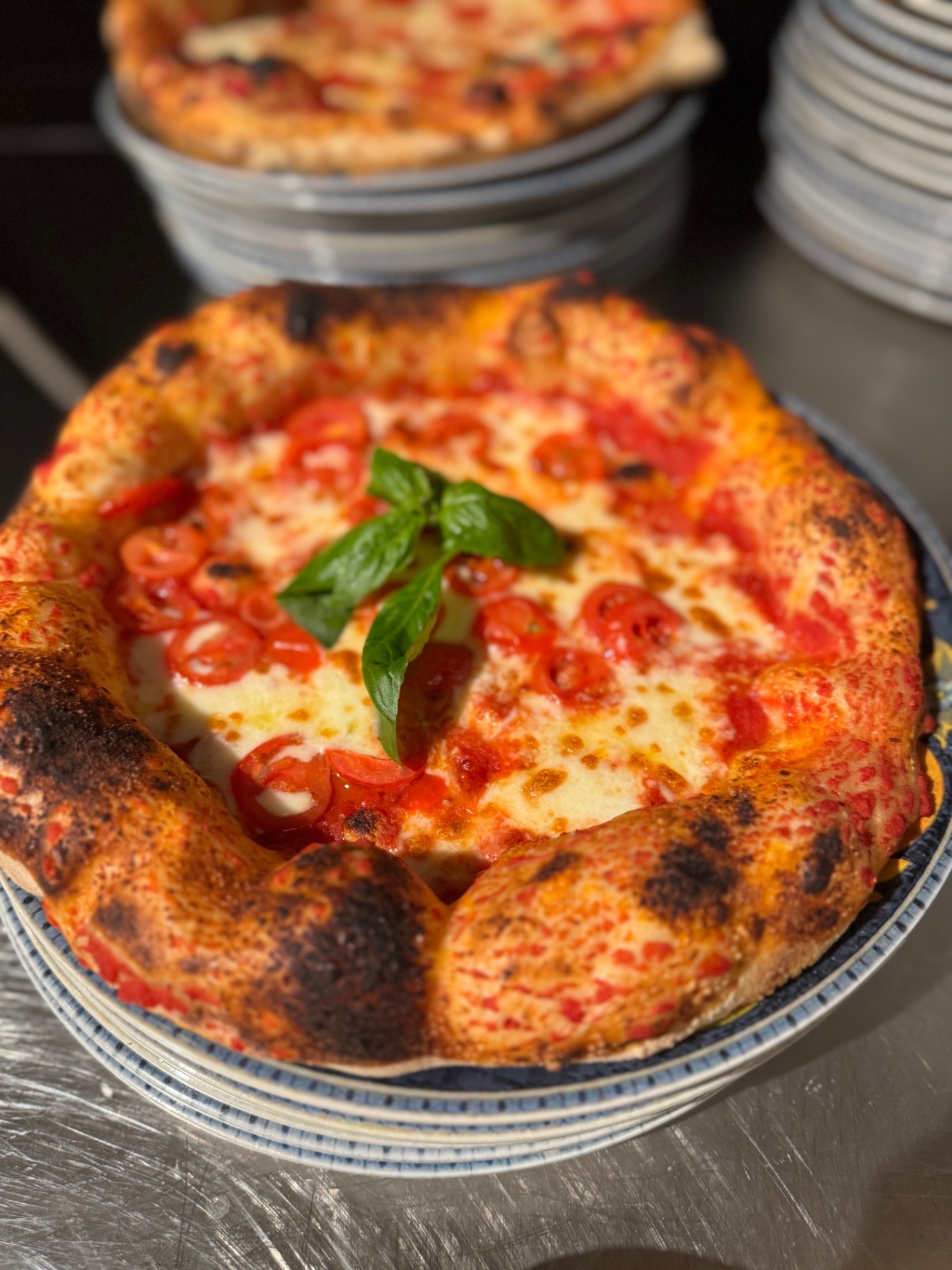 Neapolitan pizza with cherry tomatoes, fior di latte and fresh basil